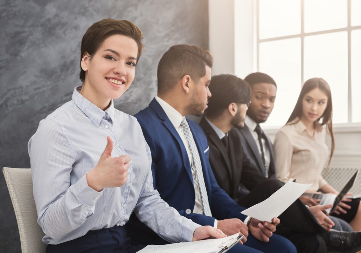 Multiracial people waiting in queue preparing for job interview