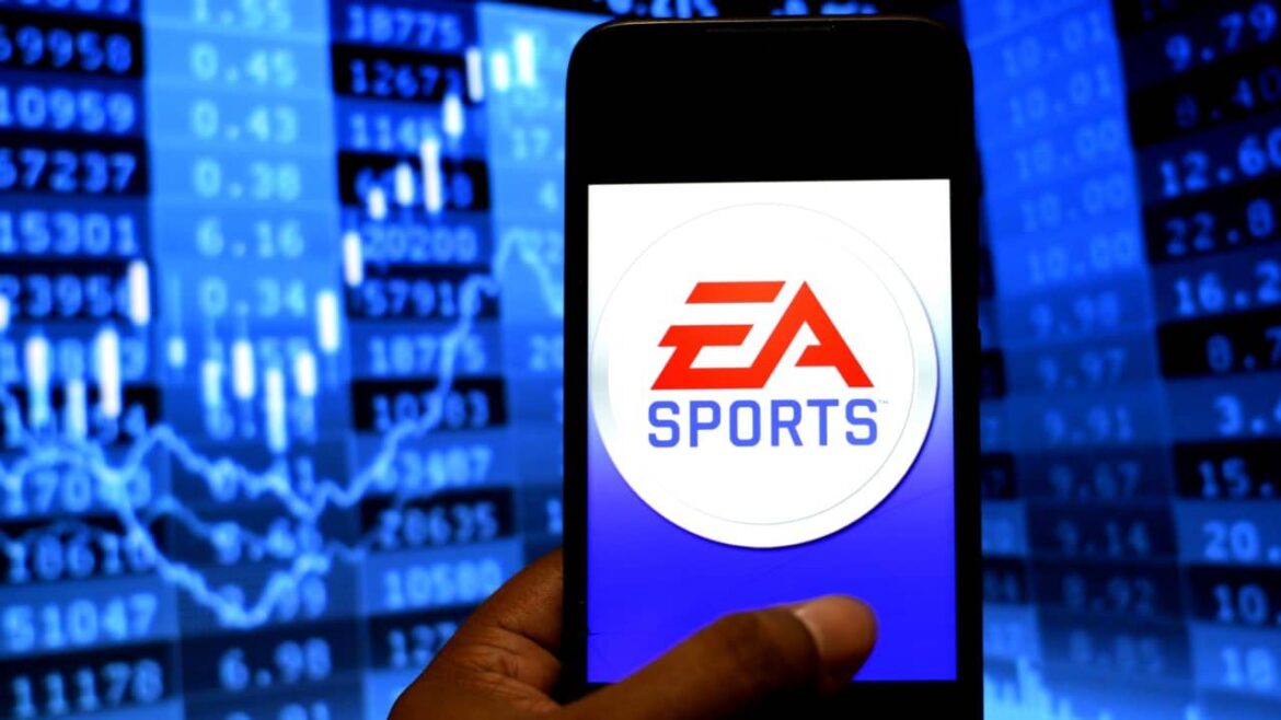 In this photo illustration an EA Sports logo seen displayed